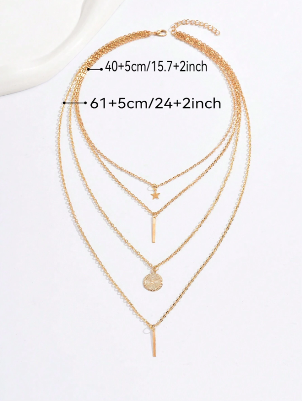 Gold necklace with multiple layers on a white background