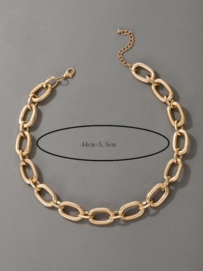 Gold chain necklace on a gray background with measurement details.