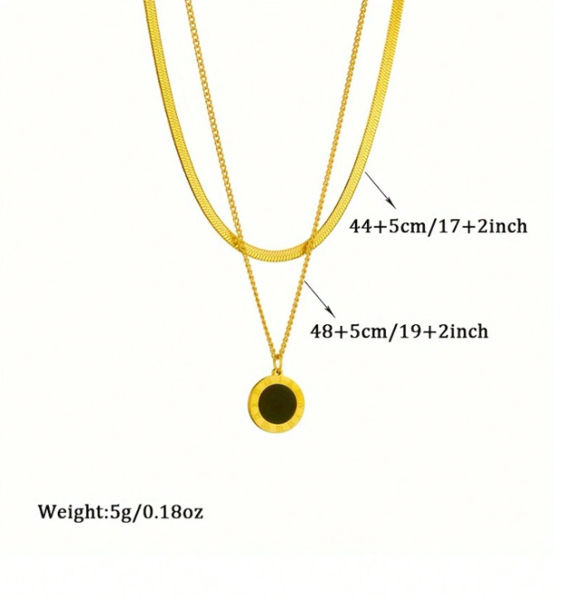 Gold necklace with a pendant, showing measurements and weight on a white background