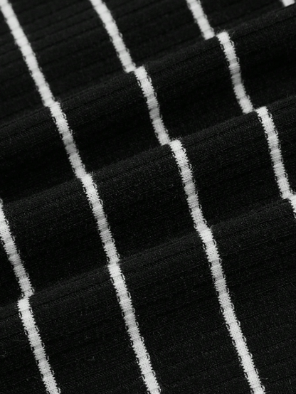 Close-up of black fabric with white pinstripes