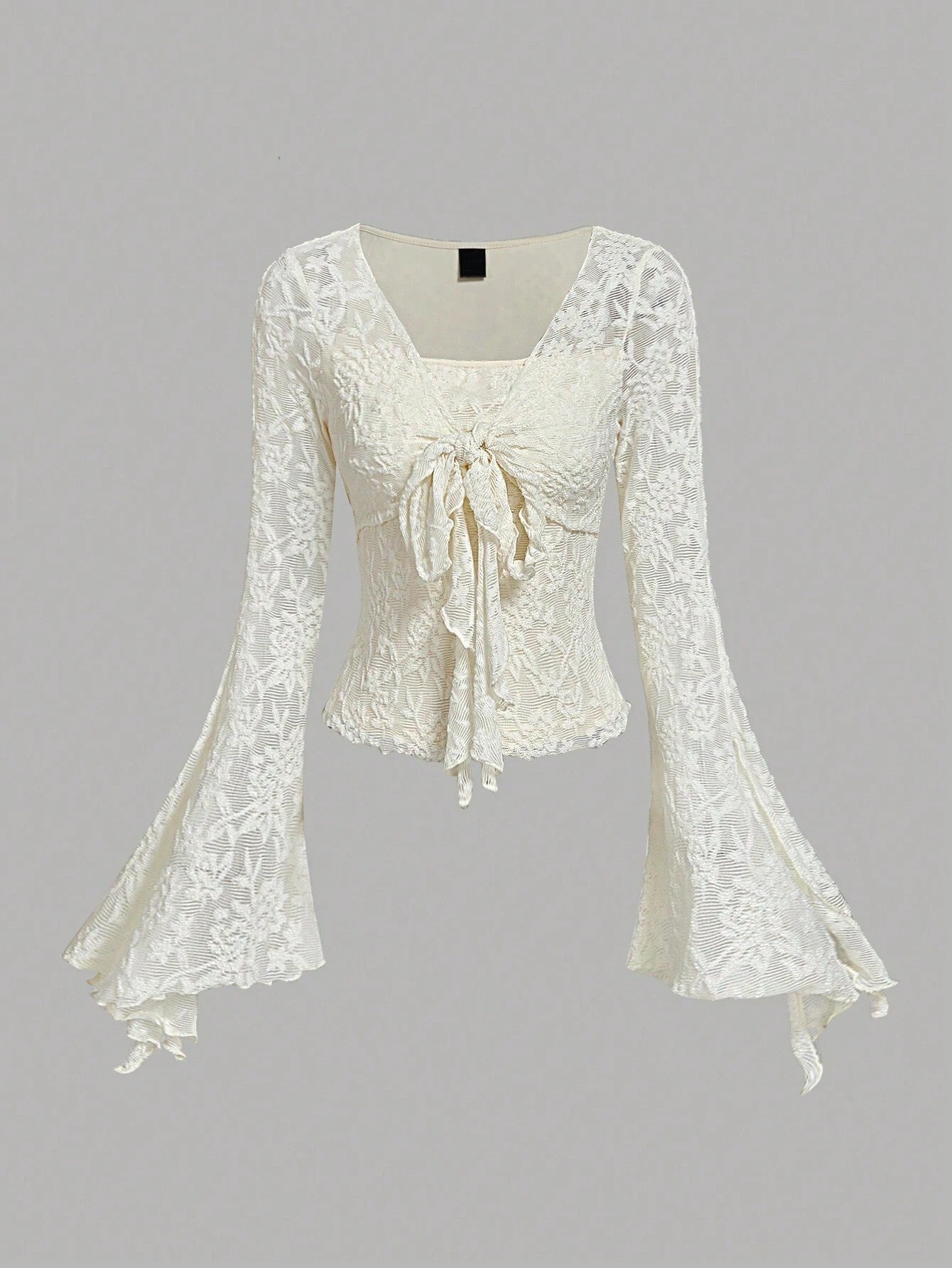 Apricot sheer floral lace tie-front long flare sleeve top laid flat against a neutral background