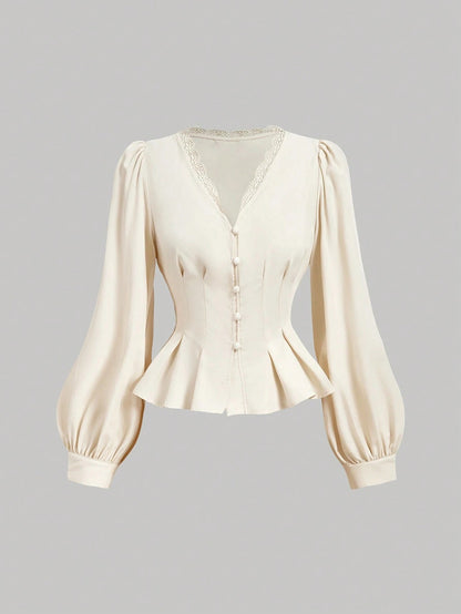Apricot striped long-sleeve peplum blouse with a lace-trim V-neck, button-front closure, and lantern sleeves against a neutral background.