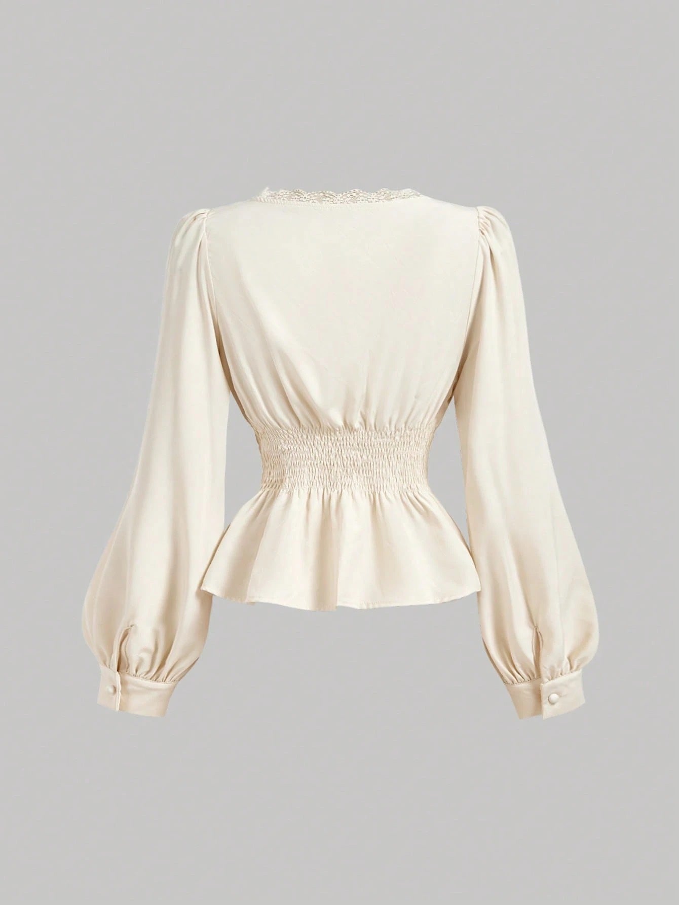 Apricot striped long-sleeve peplum blouse with a lace-trim V-neck, button-front closure, and lantern sleeves against a neutral background.