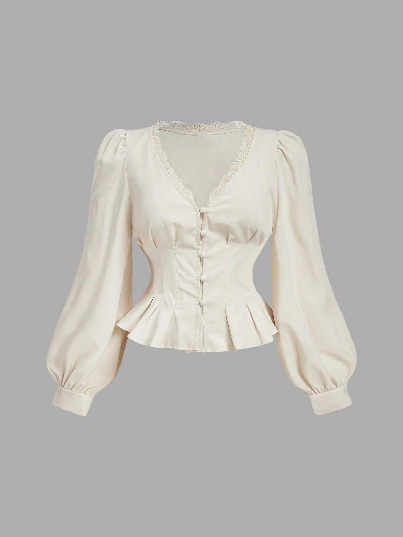 Apricot striped long-sleeve peplum blouse with a lace-trim V-neck, button-front closure, and lantern sleeves against a neutral background.