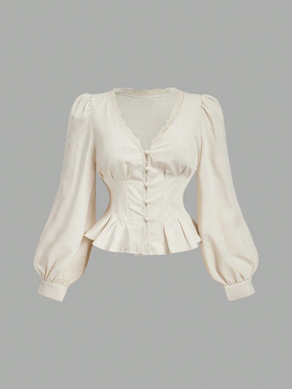 Apricot striped long-sleeve peplum blouse with a lace-trim V-neck, button-front closure, and lantern sleeves against a neutral background.