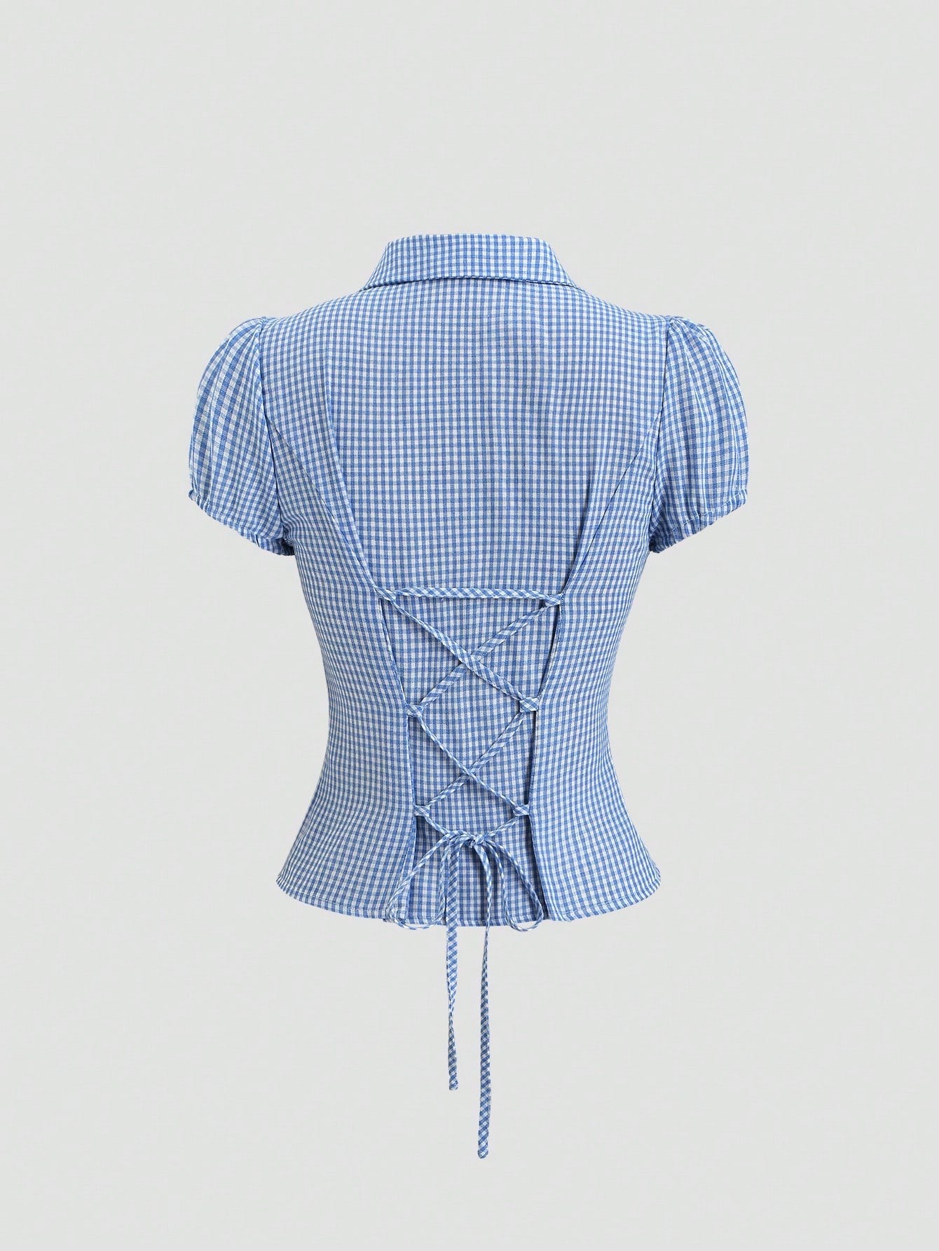 Blue and white gingham plaid short-sleeve polo collar peplum blouse with front ruffles and a laced-up back detail laid flat