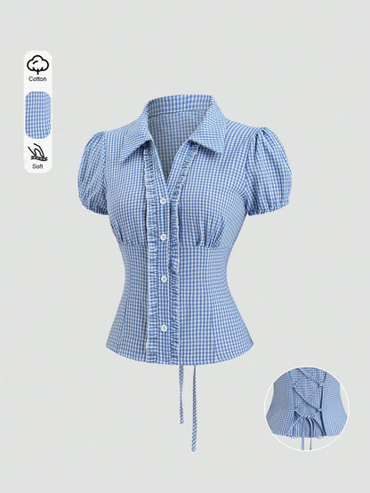 Blue and white gingham plaid short-sleeve polo collar peplum blouse with front ruffles and a laced-up back detail laid flat