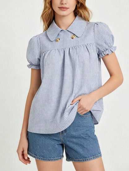 Blue and white gingham plaid short puff sleeve collared shirt with double front buttons laid flat