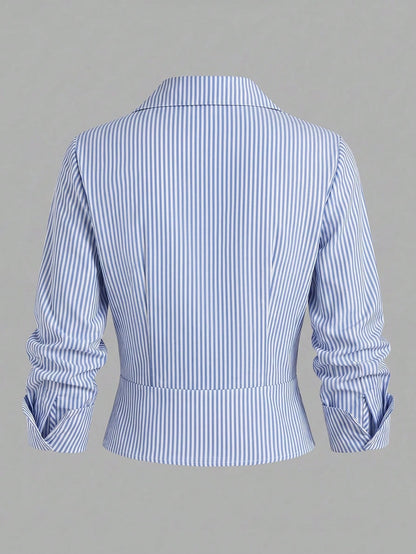 Blue and white striped 2-in-1 cropped blouse with a lapel collar and built-in white V-neck insert laid flat