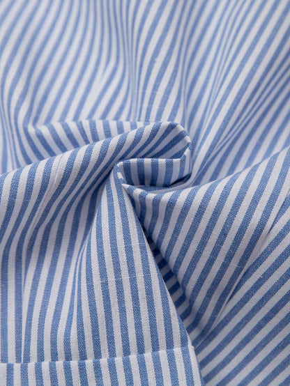 Blue and white striped 2-in-1 cropped blouse with a lapel collar and built-in white V-neck insert laid flat