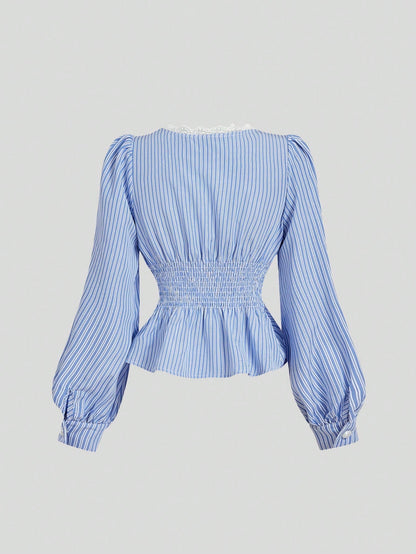 Blue and white striped long-sleeve peplum blouse with a lace-trim V-neck, button-front closure, and lantern sleeves against a neutral background.