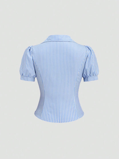 Blue and white striped short-sleeve polo collar peplum blouse with a wrap-effect ruched waist laid flat against a neutral background