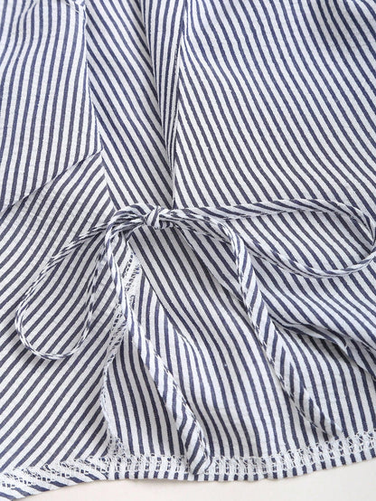 Blue and white striped wrap blouse with a collar, waist bow tie, and long flare sleeves laid flat against a neutral background