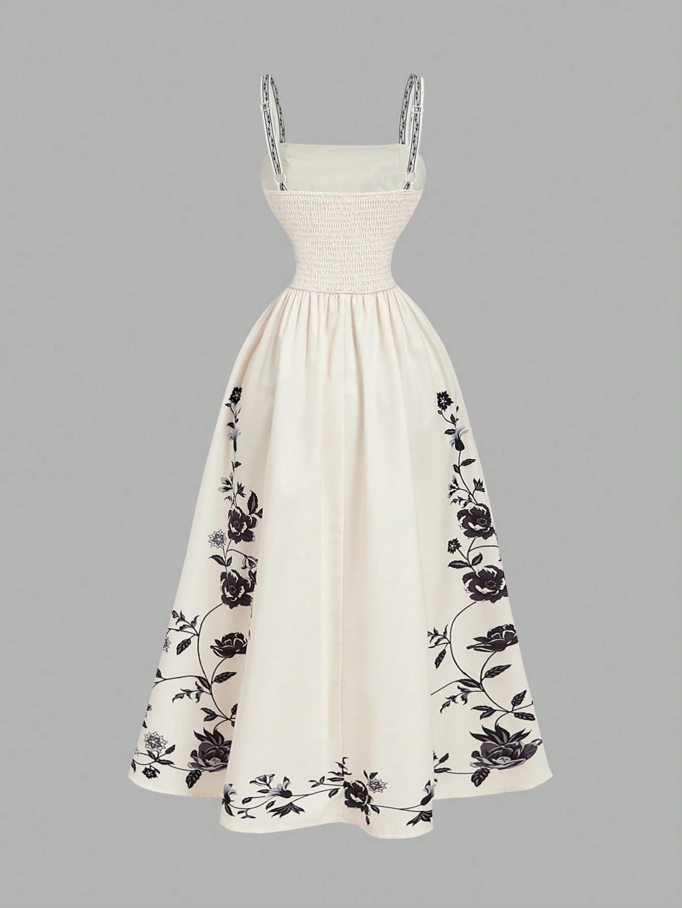 Elegant white A-line midi dress with black and white floral border print and spaghetti straps1