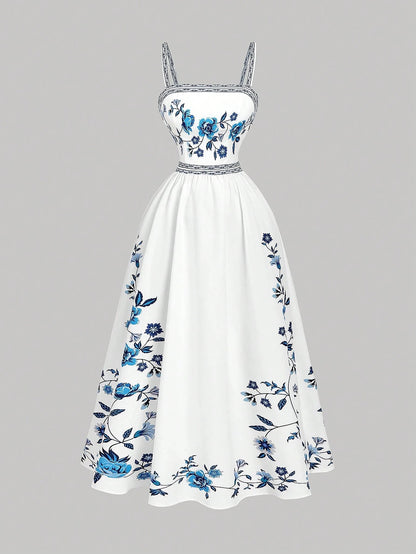 Elegant white A-line midi dress with blue floral border print and spaghetti straps
