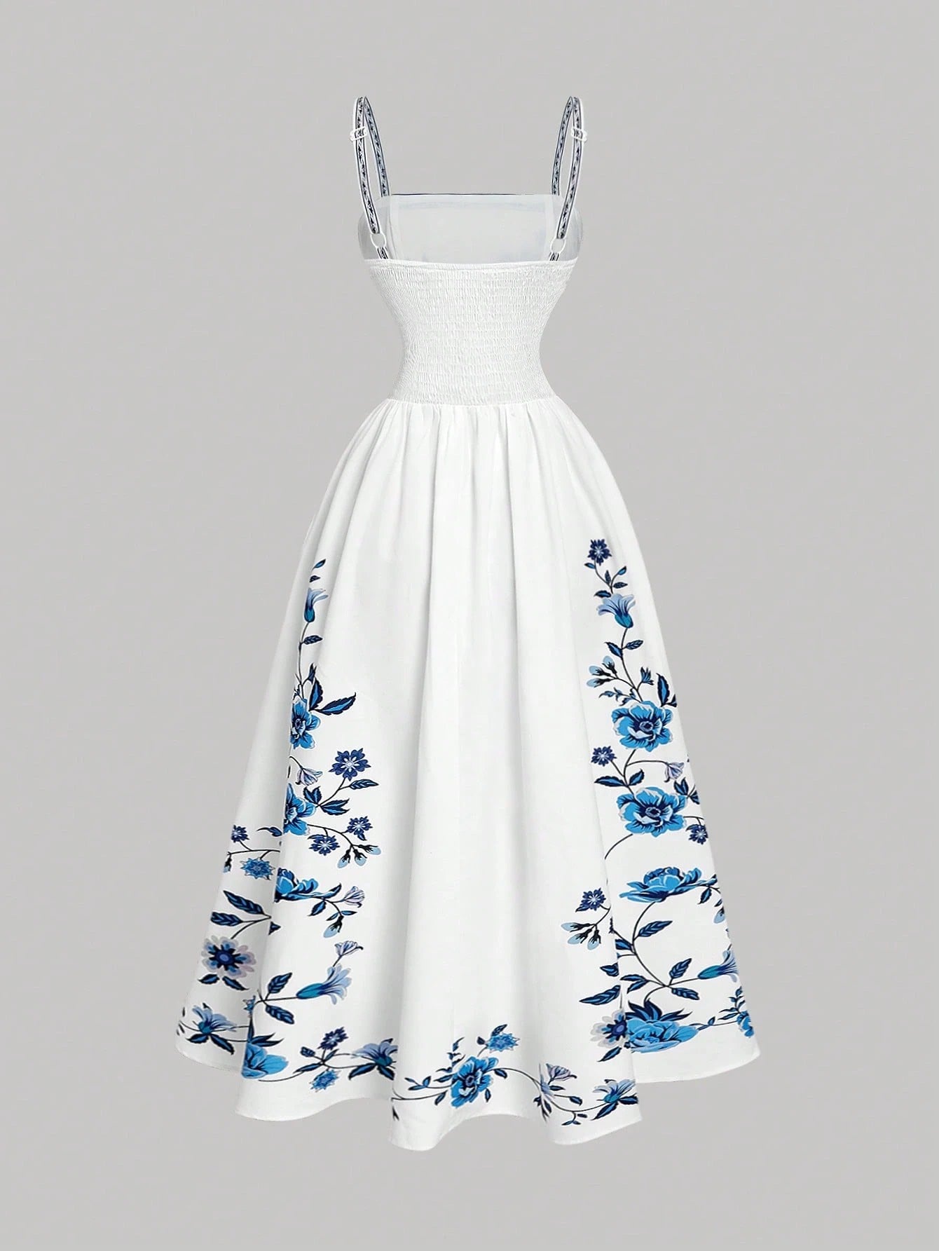 Elegant white A-line midi dress with blue floral border print and spaghetti straps1