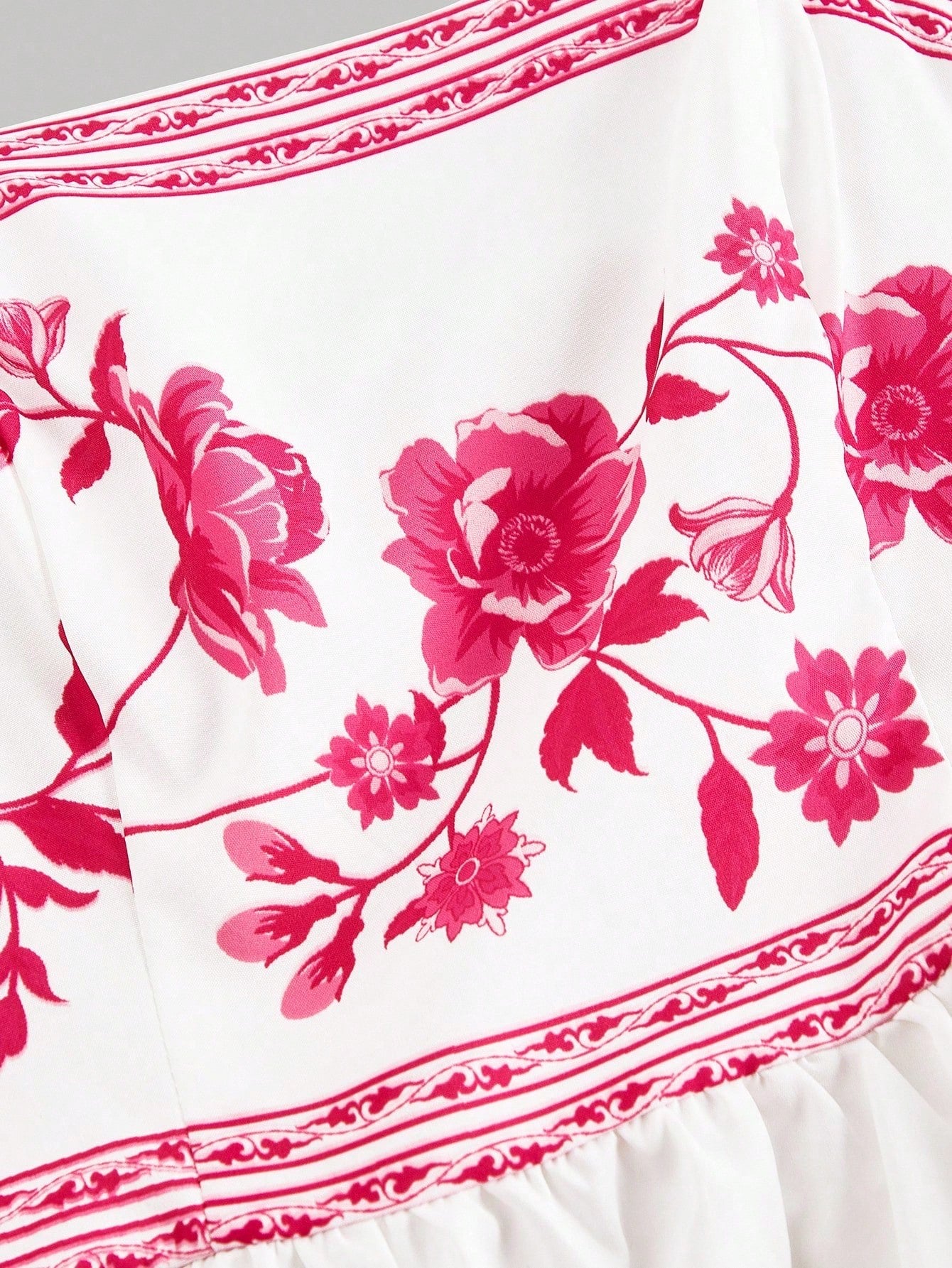 Elegant white A-line midi dress with hot pink floral border print and spaghetti straps2