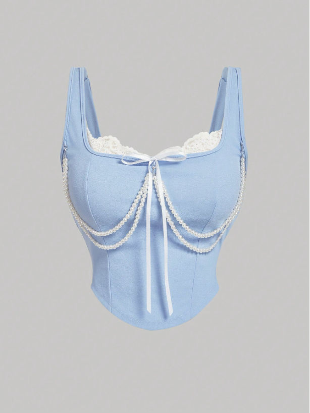 Light blue corset with lace details on a gray background