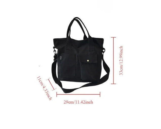 Black tote bag with measurements on a white background