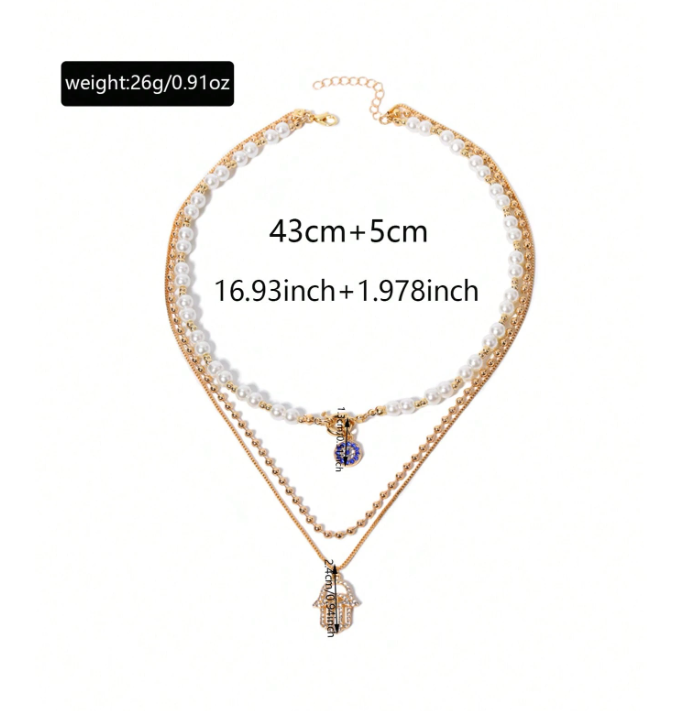 Double-layered necklace with pearl and gold chain on a white background