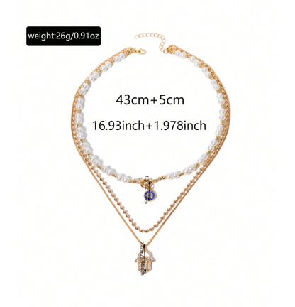 Double-layered necklace with pearl and gold chain on a white background