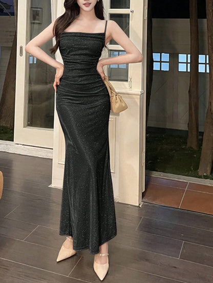 Fashzeo Black ruched mermaid long dress with spaghetti straps and shimmer fabric, designed for premium Indian party wear.