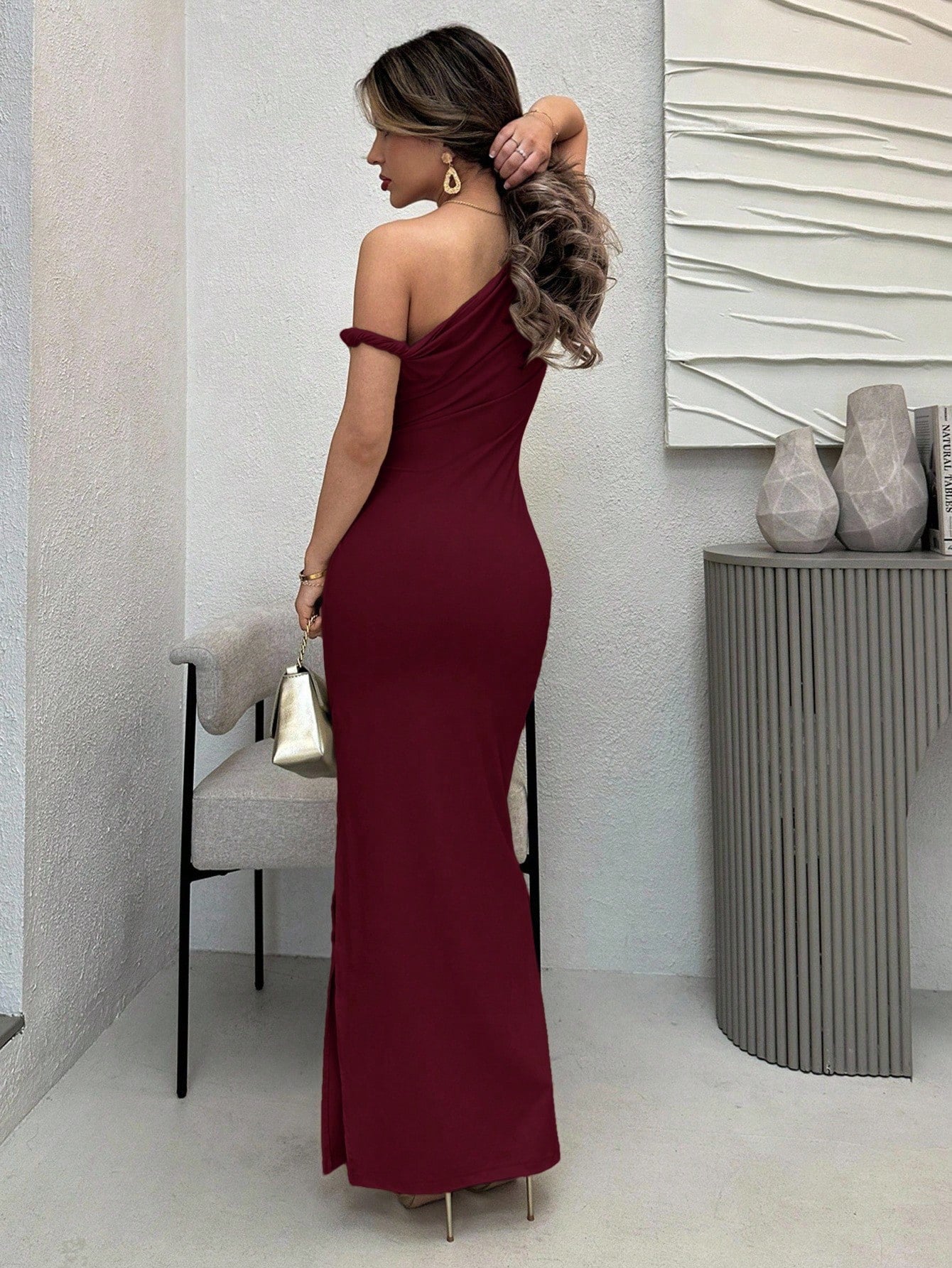 Fashzeo Burgundy Abstract Water color print long bodycon dress with asymmetrical straps, side ruching, and a high slit for elegant Indian party wear.