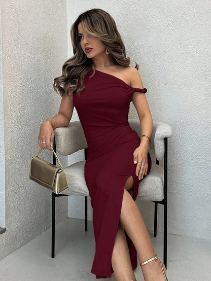 Fashzeo Burgundy Abstract Water color print long bodycon dress with asymmetrical straps, side ruching, and a high slit for elegant Indian party wear.