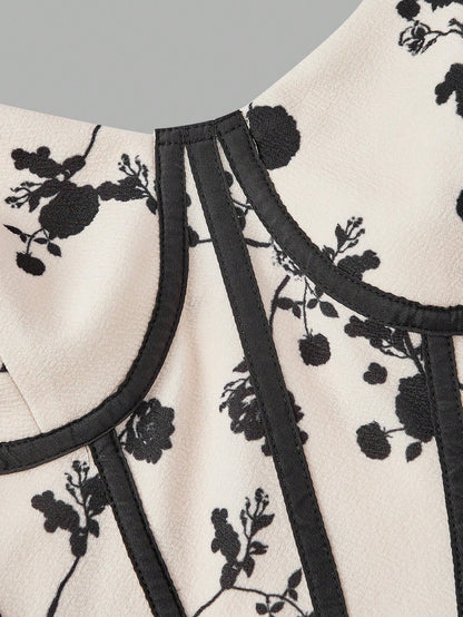 Fashzeo women's monochrome floral print midi dress with a structured corset bustier bodice and black contrast piping.