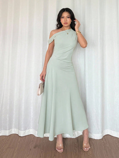 Fashzeo Pastel green one-shoulder fit and flare dress with dramatic ruffle detail for summer vacations and graduation ceremonies