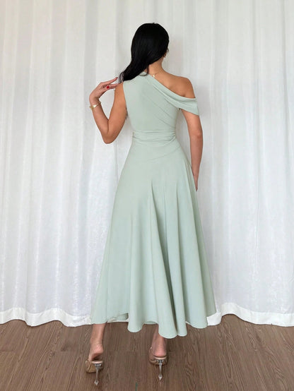 Fashzeo Pastel green one-shoulder fit and flare dress with dramatic ruffle detail for summer vacations and graduation ceremonies1