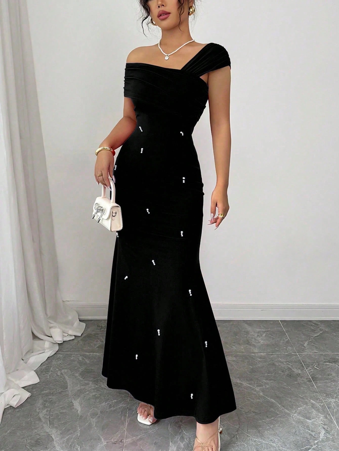 Fashzeo black asymmetrical beaded mermaid long dress featuring a sleek one-shoulder neckline and floor-length evening gown silhouette