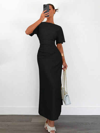 Fashzeo black linen blend long dress featuring a square neck, high slit, and ruffled fishtail hem for a quiet luxury aesthetic.