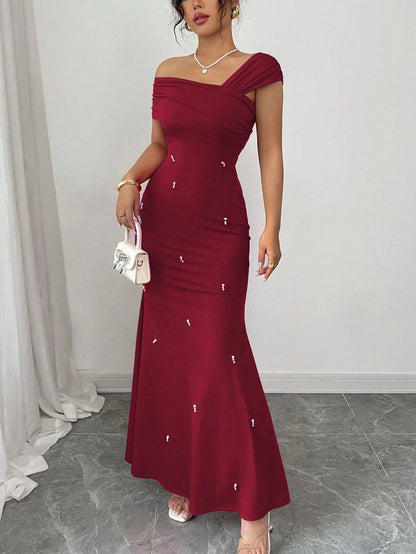 Fashzeo burgundy asymmetrical beaded mermaid long dress featuring a sleek one-shoulder neckline and floor-length evening gown silhouette
