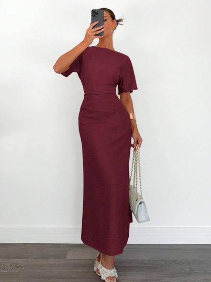 Fashzeo burgundy linen blend long dress featuring a square neck, high slit, and ruffled fishtail hem for a quiet luxury aesthetic.