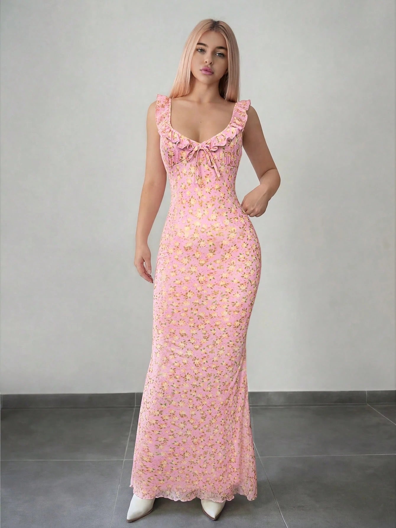 Fashzeo pink floral print ruffle-trim maxi dress with a ruched waist, styled for an elegant and trendy summer look.