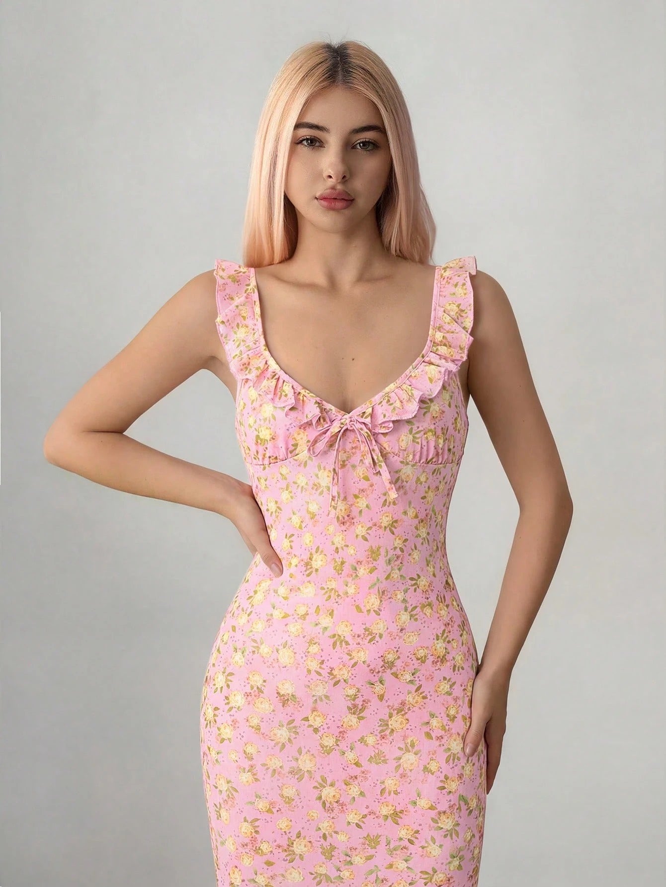 Fashzeo pink floral print ruffle-trim maxi dress with a ruched waist, styled for an elegant and trendy summer look.