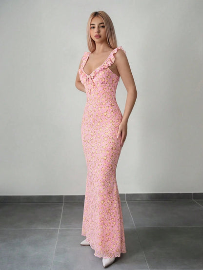Fashzeo pink floral print ruffle-trim maxi dress with a ruched waist, styled for an elegant and trendy summer look.