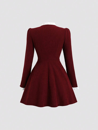 Fashzeo women's burgundy long sleeve mini dress featuring a ruffled stand collar, gold button-front, and flap pockets in a preppy vintage style1