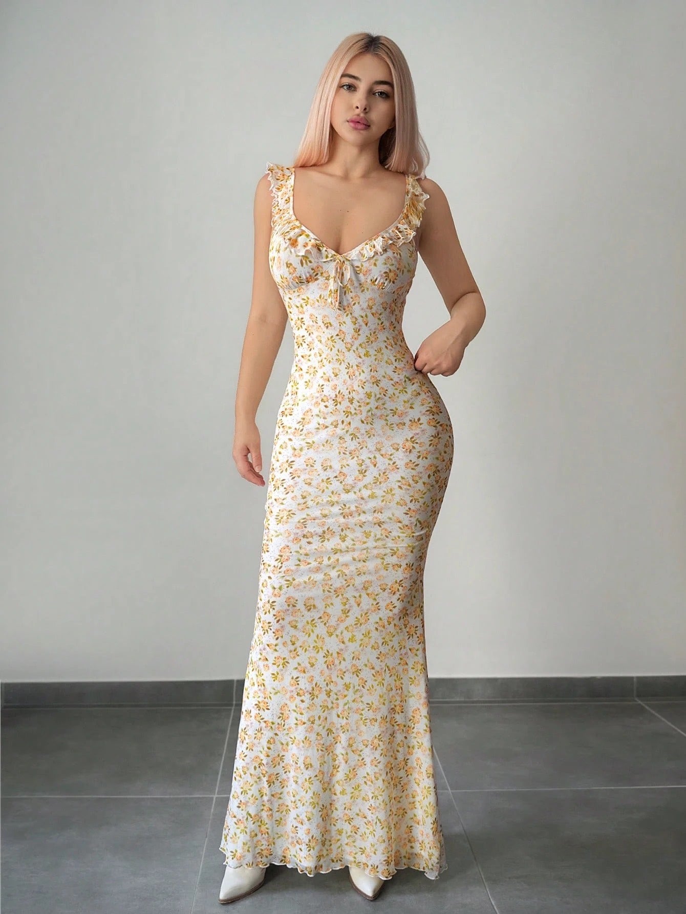 Fashzeo Yellow floral print ruffle-trim maxi dress with a ruched waist, styled for an elegant and trendy summer look.