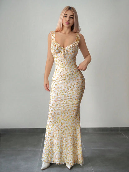 Fashzeo Yellow floral print ruffle-trim maxi dress with a ruched waist, styled for an elegant and trendy summer look.