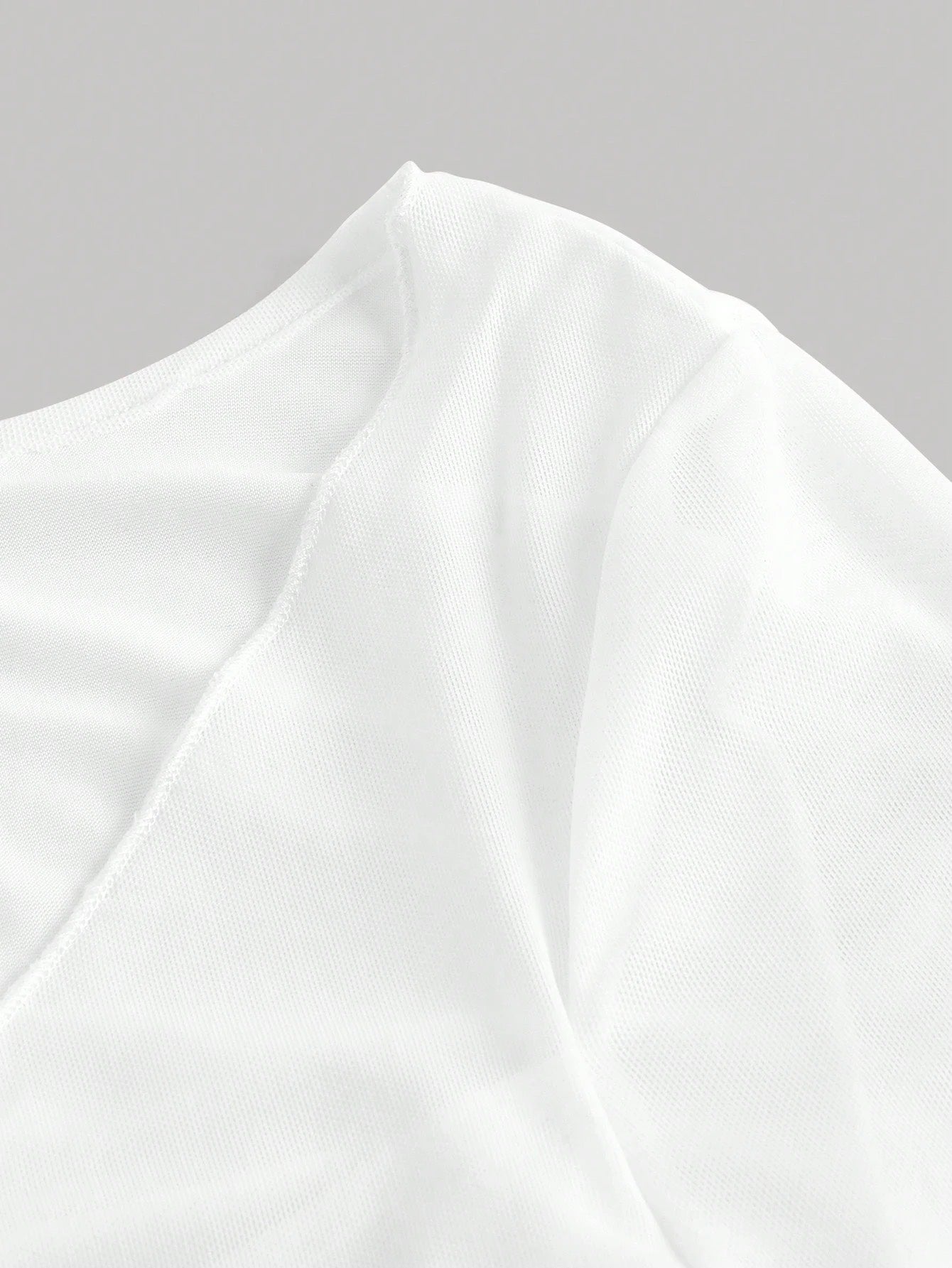Fashzeo women's white front-knot top with long sheer bell sleeves and lettuce-edge ruffle trim.