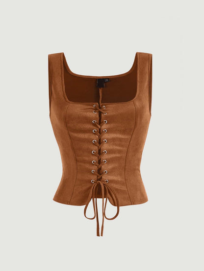 Brown leather corset top on a light gray background