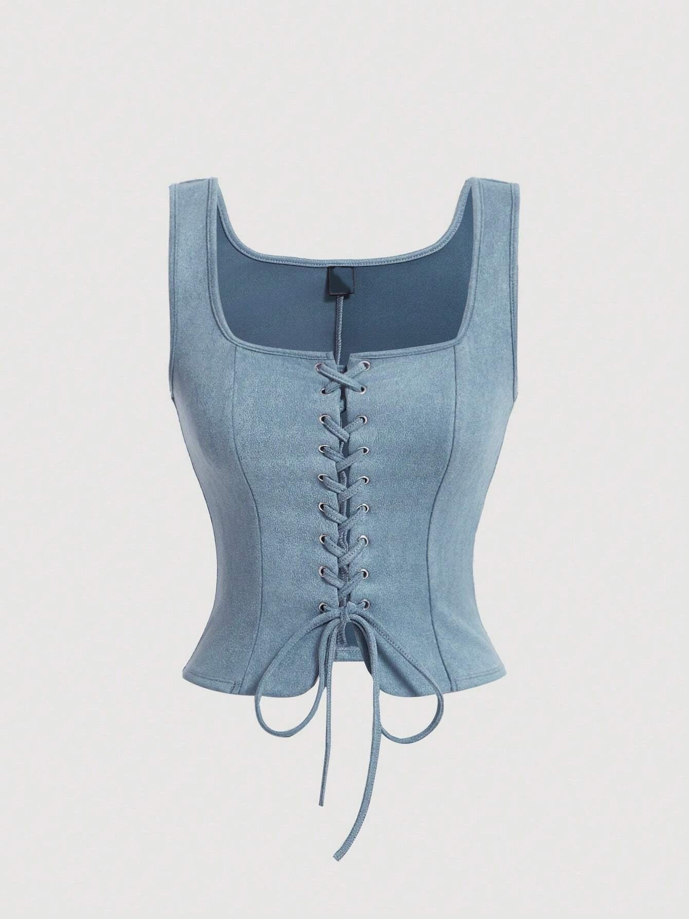 Light blue denim corset on a light gray background