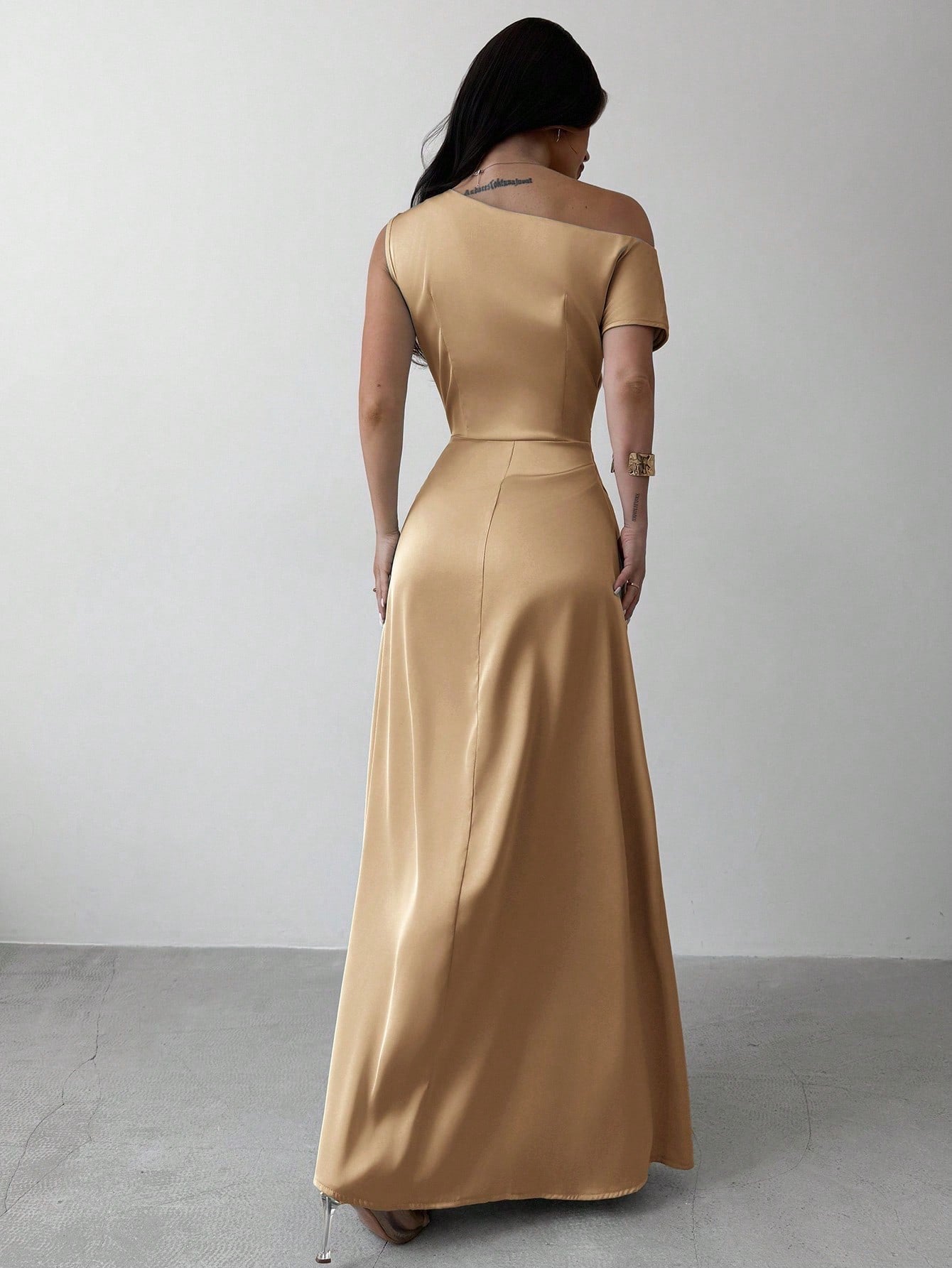 Model wearing the Fashzeo apricot satin one-shoulder maxi gown with ruched detailing