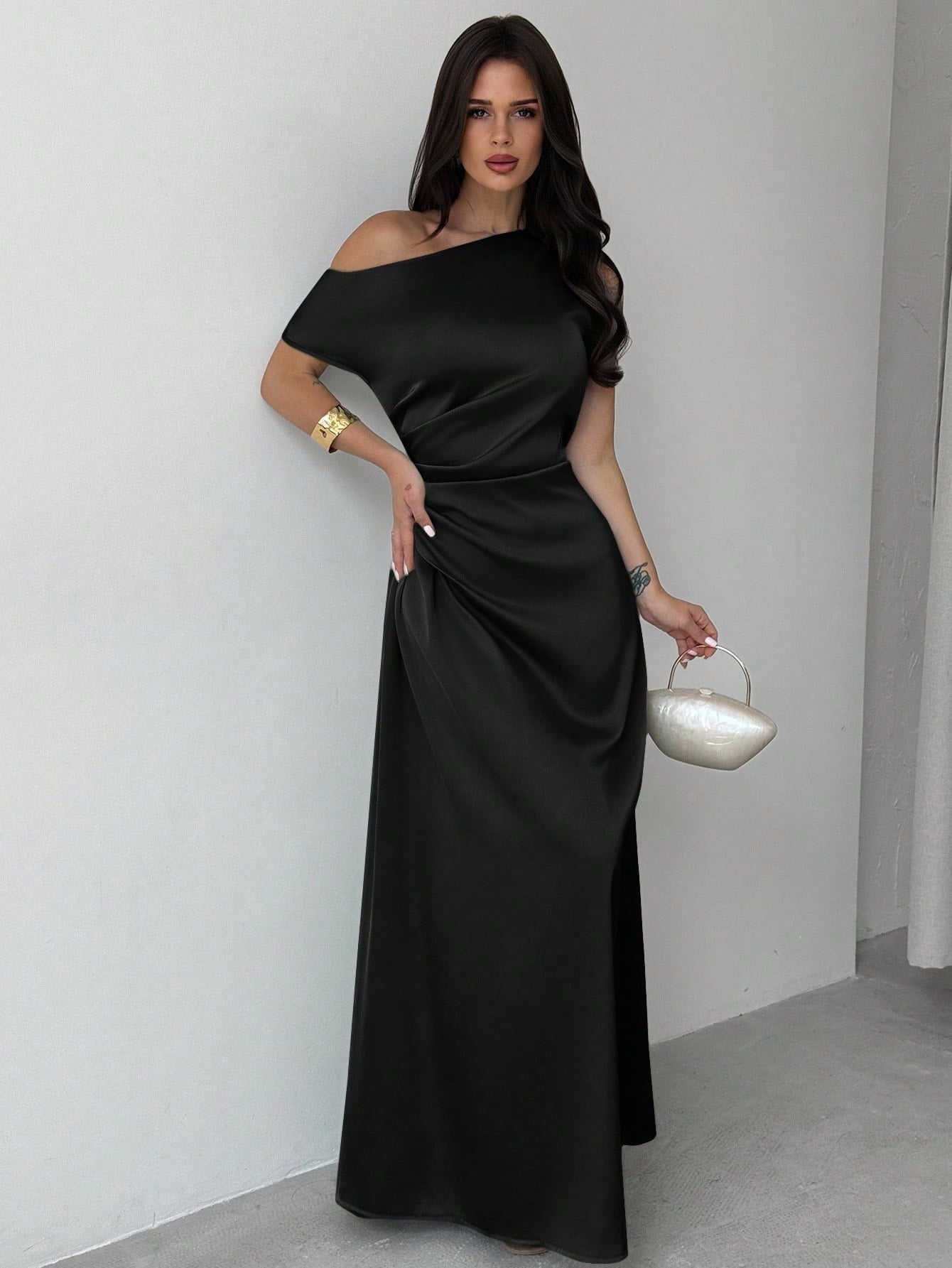 Model wearing the Fashzeo black satin one-shoulder maxi gown with ruched detailing