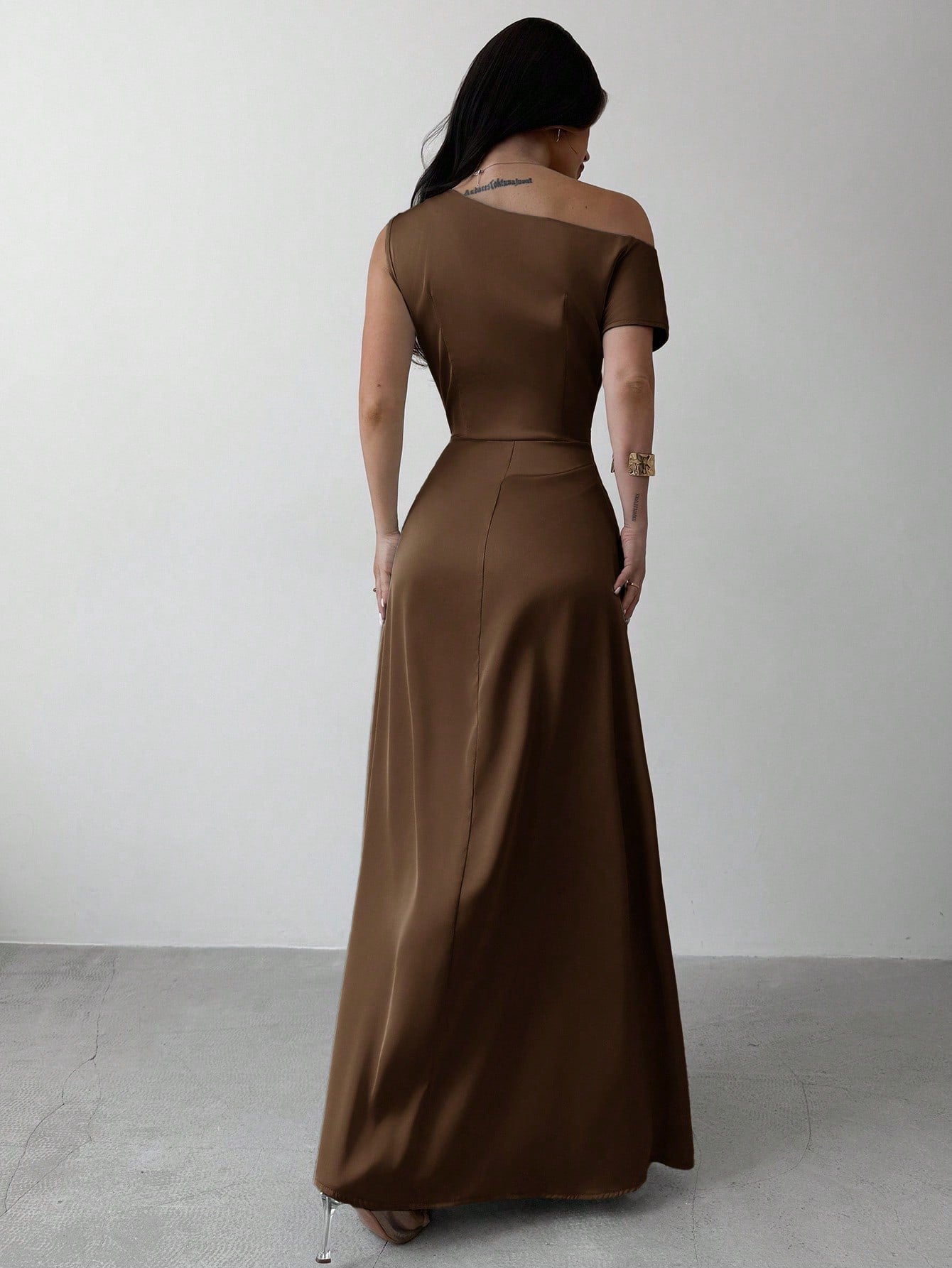 Model wearing the Fashzeo brown satin one-shoulder maxi gown with ruched detailing