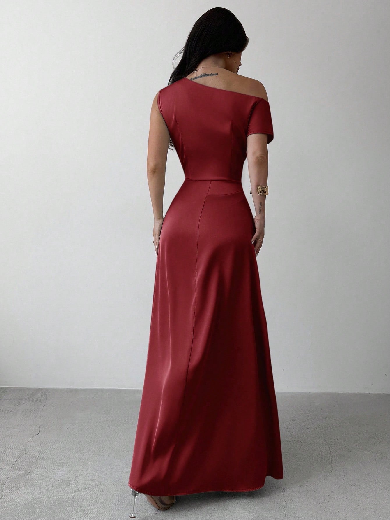 Model wearing the Fashzeo burgundy satin one-shoulder maxi gown with ruched detailing