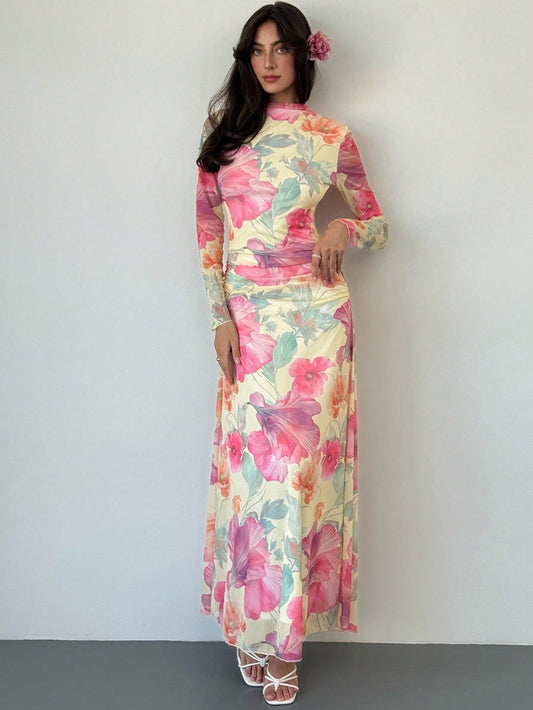 Model wearing the Fashzeo floral mesh long-sleeve maxi dress in apricot multicolor.