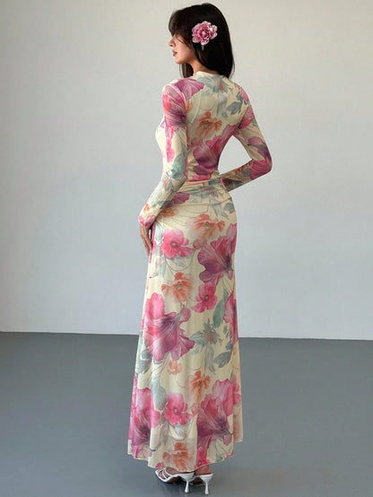 Model wearing the Fashzeo floral mesh long-sleeve maxi dress in apricot multicolor.